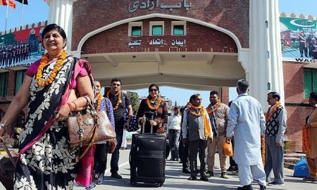 Indian pilgrims to historical Hindu temple in Karak