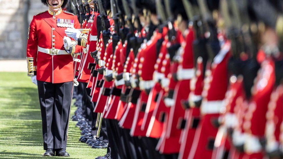 Irish Guards troops and a Coldstream Guardsman veteran